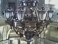 The chandelier being raised after restoration.