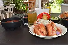 Torta ahogada accompanied by light beer, Jalisco.