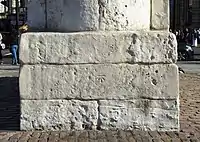 Benchmark on the plinth of the statue of King Charles I in Trafalgar Square, London: the site of the medieval Charing Cross, and the point from which distances from London are calculated