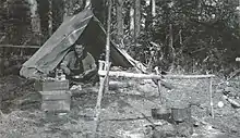 John Leslie Charles in camp during work on the Hudson Bay Railway survey 1914.