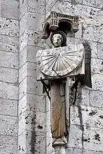 Angel with a sundial on south facade