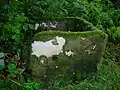 'Side' view of the possible primitive cheese press with holes visible.