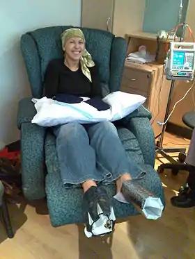 A cancer patient in a head scarf after losing her hair due to Chemotherapy.