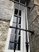 Close up view of one of the barred windows on the tower