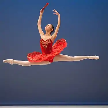 A ballerina performing a grand jeté.