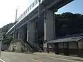 The steps up the dias and the toilet building