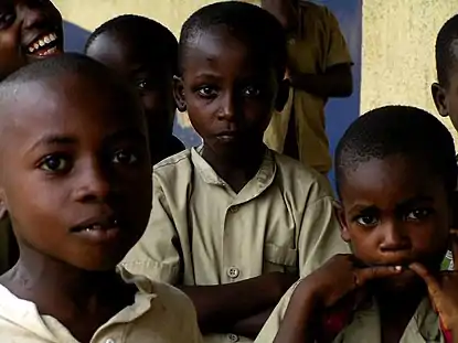 three children looking directly at camera