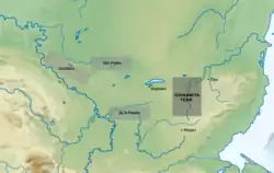 Physical map of Belize and northern Guatemala, with the most commonly accepted location of the Chinamita Territory marked in dark grey (east of Nojpeten, on the Mopan River, between Nojpeten and Tipu), and three alternative locations marked in light grey (all west of Nojpeten, (a) on Río San Pedro, (b) in the cordillera between Río Usumacinta and Río San Pedro, and (c) on Río de la Pasión)