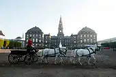 Palace with horse-drawn cart outside