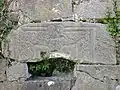 A Sheela na gig, often seen as a fertility symbol. Placed upside down.