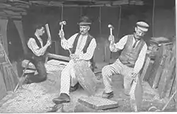 Quarrymen splitting slate at Dinorwig Quarry, Wales c. 1910