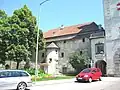 City wall next to gate-tower at Wels with early semi-lune tower.