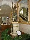 Monumental conical pendulum clock by Eugène Farcot, sculpture by Albert-Ernest Carrier-Belleuse. Purchased at the 1878 Paris world fair, in vestibule.