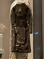 Cleric slaying a dragon with a staff on the drop of the Clonmacnoise Crozier