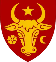 A shield depicting the head of an aurochs, surrounded by a star, a crescent and a flower