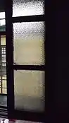 Patterned glass windows at the dining area