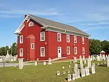 View from the southwest. Note that the rear section was added since the postcard picture