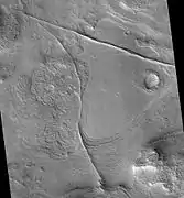 Coloe Fossae Dikes and/or faults, as seen by HiRISE.  Dikes and faults may have produced mineral deposits.  Coloe Fossae is in the Ismenius Lacus quadrangle.