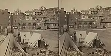 Contraband camp at Harpers Ferry, Virginia (now West Virginia), about 1861. Note John Brown's Fort in background.