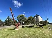 Railway crane and silos.