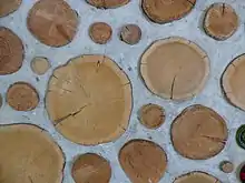 Cordwood masonry wall detail. This alternative building method is called cordwood masonry, cordwood construction or stackwall because the wall resembles a stack of cordwood. Source: Rob Roy, Earthwood Building School. http://www.cordwoodmasonry.com