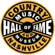 The logo of the Country Music Hall of Fame and Museum. It is features black and yellow stripes with a circular design.