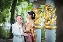 Couple dress in traditional Thai outfits