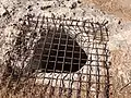 Pit with iron grating