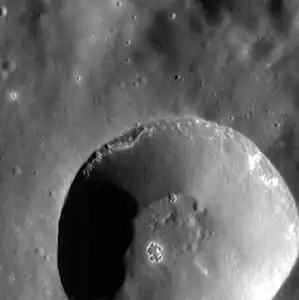 Close up of 12 km diameter crater with hollows in the southern half of Jobim