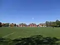 The Cricket Oval where patients used to play cricket, with cottages in the background.