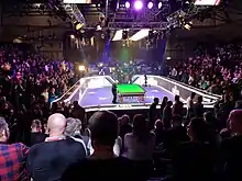 image of snooker table and crowd