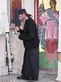 Monk working in the church