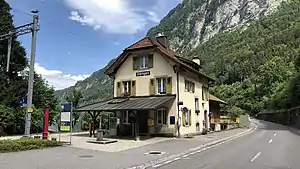 Three-story building with half-hipped roof