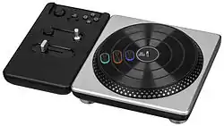 A black turntable with three buttons on the rotating deck.