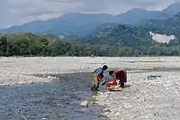 At the river bed for their daily needs