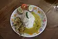 Dal bhat served with eggplant dish and salad.