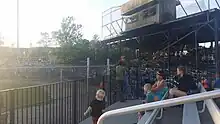 The grandstand and first-base side bleachers of Damaschke Field during a 2017 game.