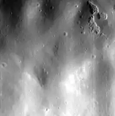 High-resolution image of one of the hollows (upper right) on the east side of the central peak.  The image is about 2.8 km wide.