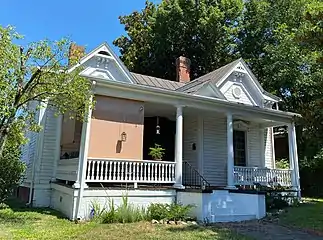 North Danville Queen Anne style home built in a gabled ell form during the late 1800s. It has original weatherboard siding. The veranda has spindle balusters and the window hoods have brackets.