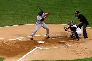 Image 9David Ortiz, the batter, awaiting a pitch, with the catcher and umpire (from Baseball)