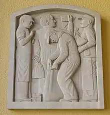 sculpture on east side of main entrance. Signed: David Slivka, 1937