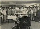 Members of staff, students and members of the public pay their respects.