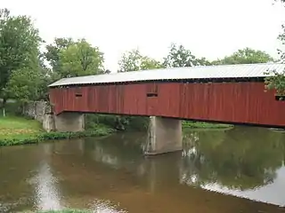 Pre-arson Dellville Covered Bridge, seen from the parallel concrete bridge.