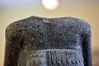 Detail showing the cuneiform inscription on the back of the upper torso of the statue of Entemena