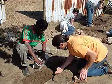 Diallo working alongside a few of his neighbors