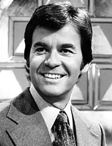 A black-and-white head shot of Dick Clark