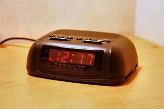 A basic digital clock radio with analog tuning