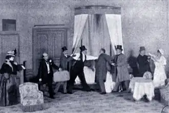 stage scene with a brawl in progress in a hotel bedroom