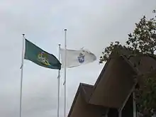 Flags of Holy Trinity Cathedral and the Diocese of Auckland, with the west window of the cathedral