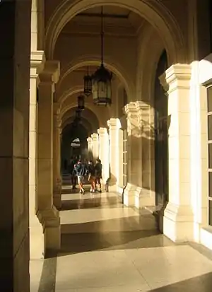 Schoolkids in a sunlit arcade in Havana, Cuba.